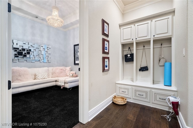 mudroom with a chandelier, dark hardwood / wood-style flooring, and ornamental molding