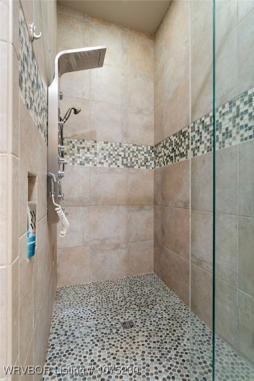 bathroom with tiled shower