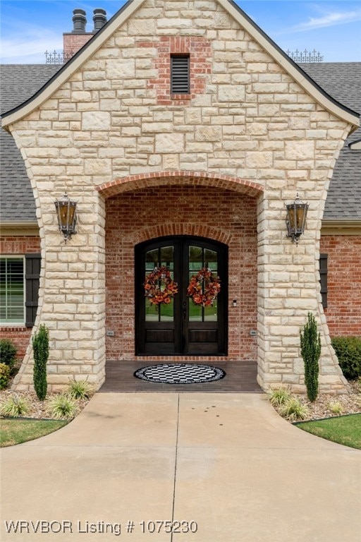 property entrance featuring french doors