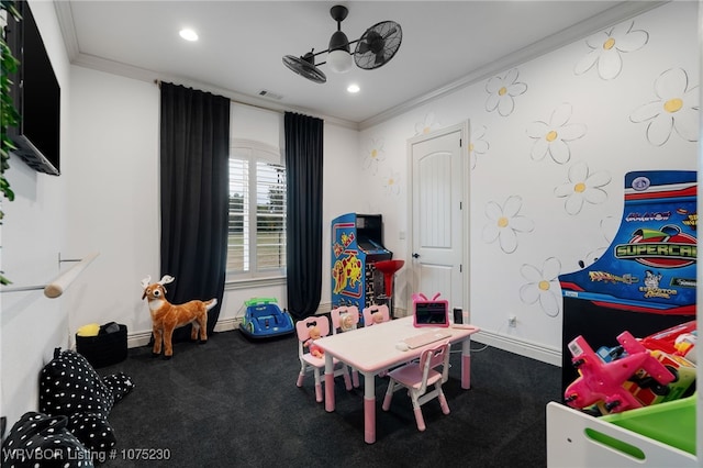 recreation room featuring carpet floors, ceiling fan, and crown molding