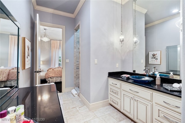 bathroom featuring tile patterned flooring, vanity, and ornamental molding