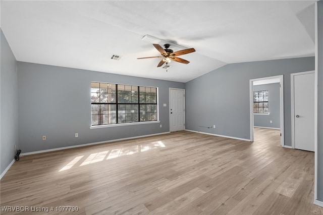 empty room with light hardwood / wood-style floors, ceiling fan, and lofted ceiling