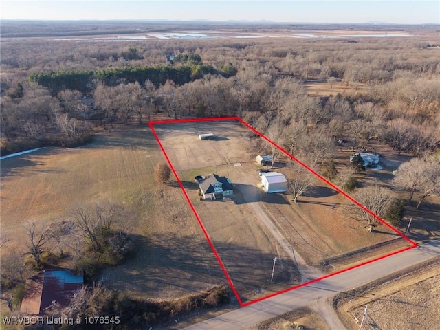 birds eye view of property with a rural view