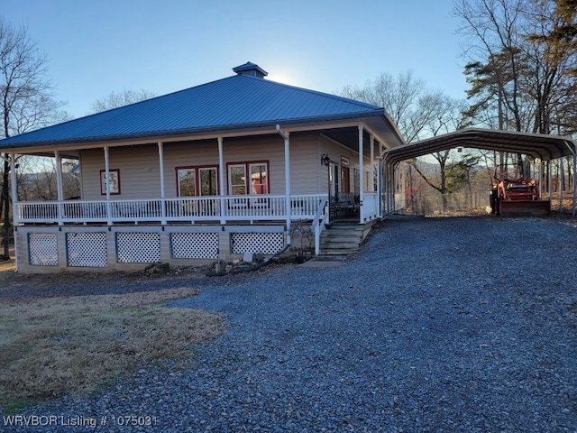 view of front of house featuring a carport and a porch