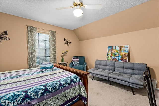 carpeted bedroom with ceiling fan, a textured ceiling, and vaulted ceiling