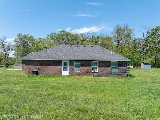 24401 Brazil Creek Loop, Shady Point, OK 74956 - rear view of property with cooling unit, a lawn, brick siding, and fence