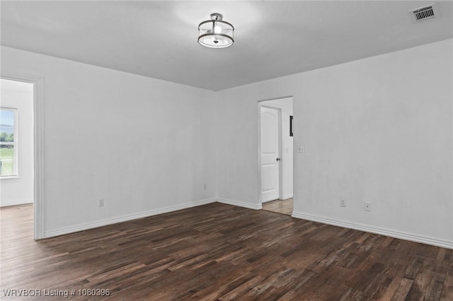 24401 Brazil Creek Loop, Shady Point, OK 74956 - empty room featuring baseboards, wood finished floors, and visible vents