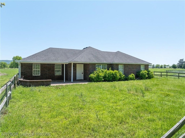 24401 Brazil Creek Loop, Shady Point, OK 74956 - view of front of house with brick siding, a patio area, a front yard, and fence
