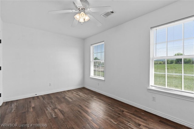 24401 Brazil Creek Loop, Shady Point, OK 74956 - spare room with baseboards, wood finished floors, and visible vents