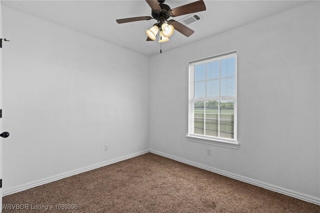 24401 Brazil Creek Loop, Shady Point, OK 74956 - spare room featuring baseboards, a ceiling fan, visible vents, and carpet