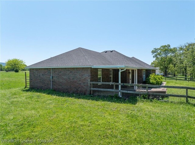 24401 Brazil Creek Loop, Shady Point, OK 74956 - back of property with fence, a lawn, and brick siding