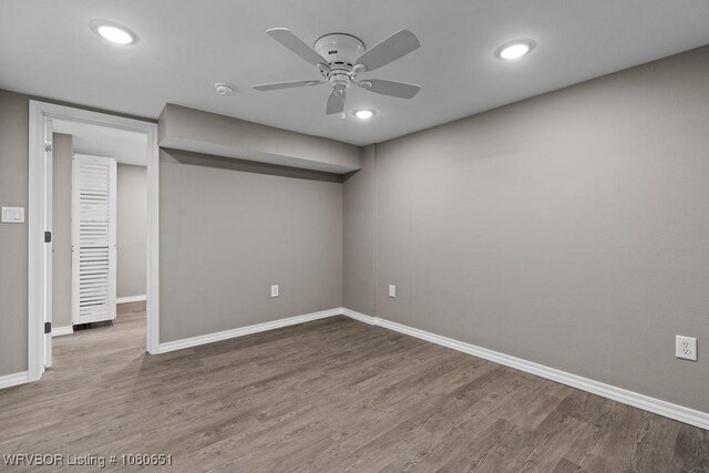 11 N 13th St, Van Buren, AR 72956 - below grade area featuring a ceiling fan, baseboards, recessed lighting, and wood finished floors