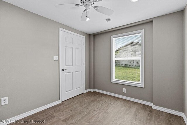 11 N 13th St, Van Buren, AR 72956 - unfurnished room featuring baseboards, ceiling fan, and wood finished floors