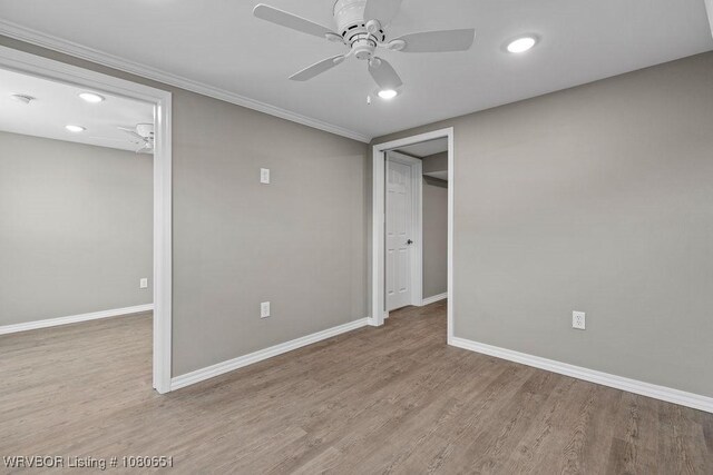 11 N 13th St, Van Buren, AR 72956 - unfurnished bedroom featuring recessed lighting, baseboards, a ceiling fan, and wood finished floors