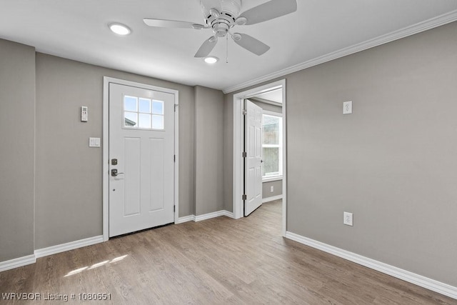 11 N 13th St, Van Buren, AR 72956 - entrance foyer with crown molding, baseboards, a ceiling fan, and wood finished floors