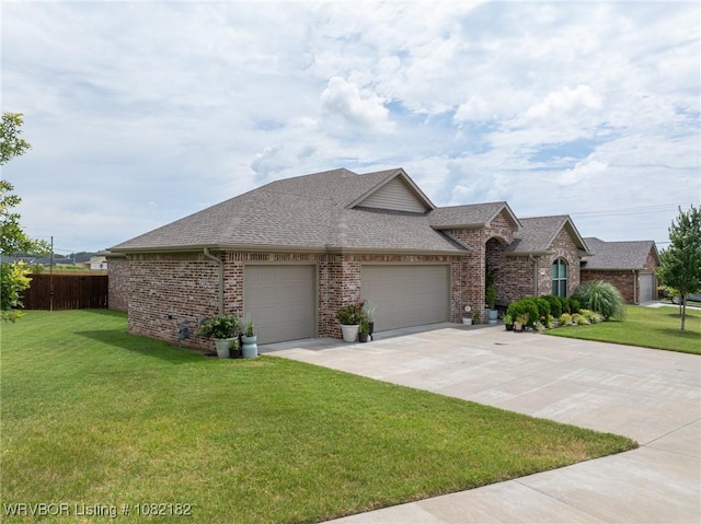 9505 Harmony Ridge Rd, Fort Smith, AR 72916 - view of front of property with brick siding, a garage, and a shingled roof