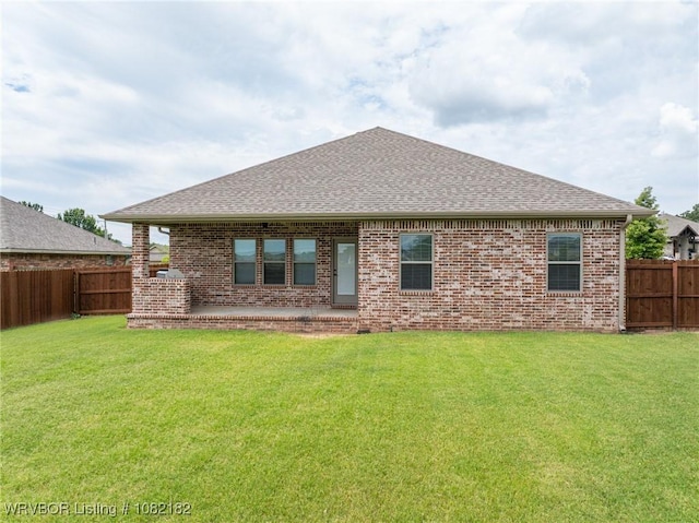 9505 Harmony Ridge Rd, Fort Smith, AR 72916 - back of property featuring a shingled roof, a fenced backyard, and brick siding
