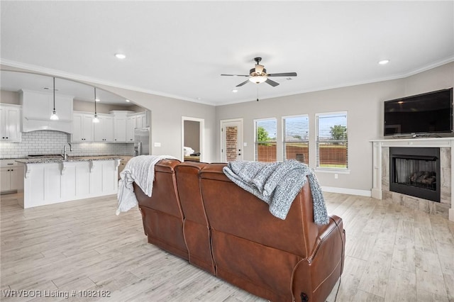 9505 Harmony Ridge Rd, Fort Smith, AR 72916 - living area with a ceiling fan, ornamental molding, light wood-type flooring, recessed lighting, and arched walkways