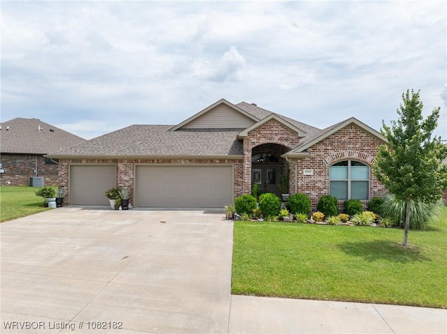 9505 Harmony Ridge Rd, Fort Smith, AR 72916 - view of front of home featuring brick siding, a shingled roof, an attached garage, and a front lawn