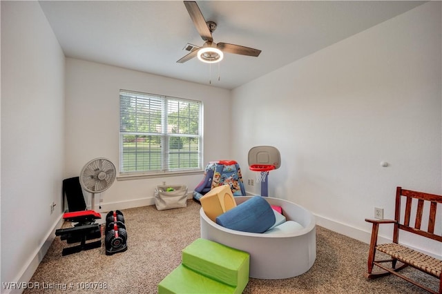 game room with a ceiling fan, baseboards, visible vents, and carpet