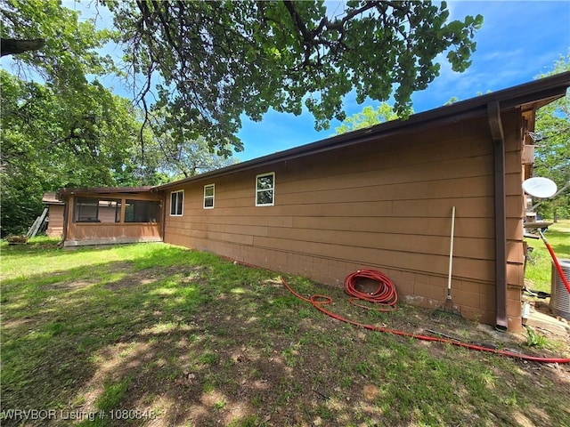 back of house with a yard