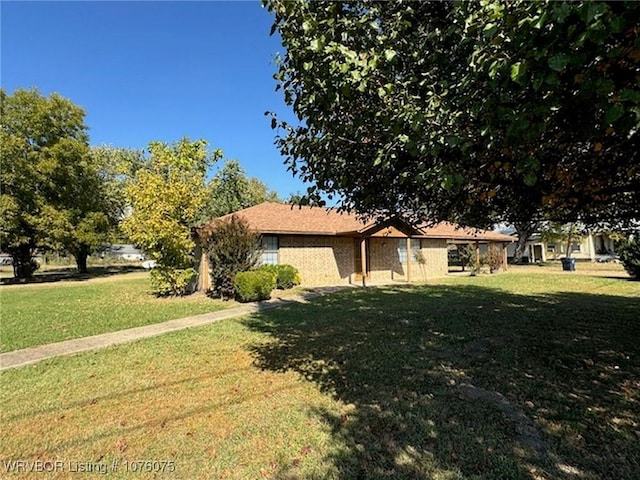 view of property exterior featuring a lawn