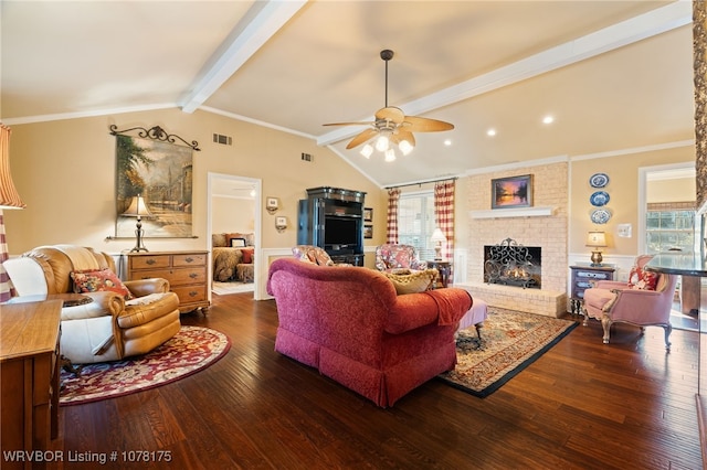 living room with a brick fireplace, vaulted ceiling with beams, dark hardwood / wood-style floors, and ceiling fan