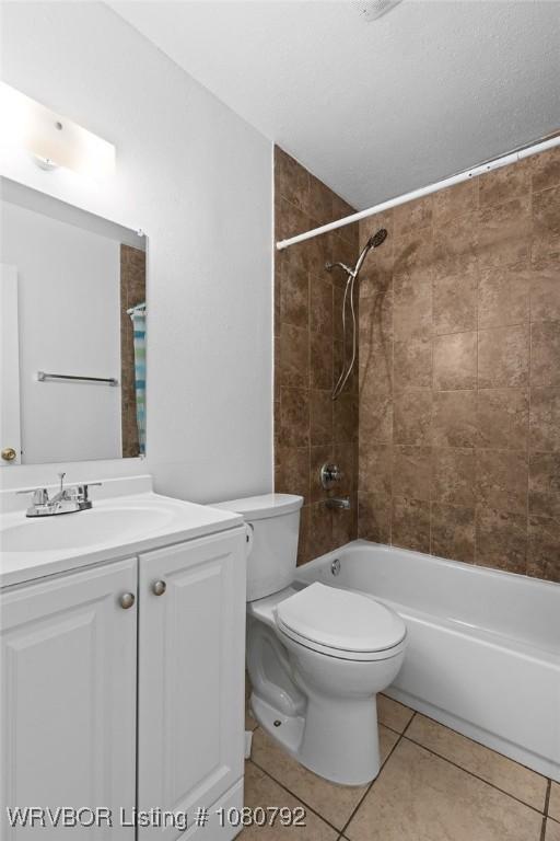 4308 25th St, Fort Smith, AR 72901 - bathroom featuring toilet, bathing tub / shower combination, tile patterned flooring, and vanity