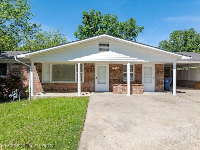4308 25th St, Fort Smith, AR 72901 - view of front of home with concrete driveway, brick siding, and a front yard