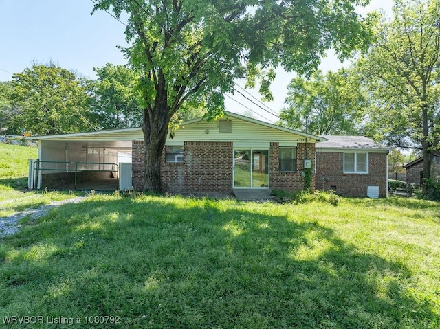 4308 25th St, Fort Smith, AR 72901 - back of property featuring a yard, brick siding, and a carport