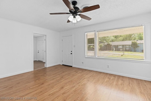 4308 25th St, Fort Smith, AR 72901 - empty room with a wealth of natural light, ceiling fan, and a textured ceiling