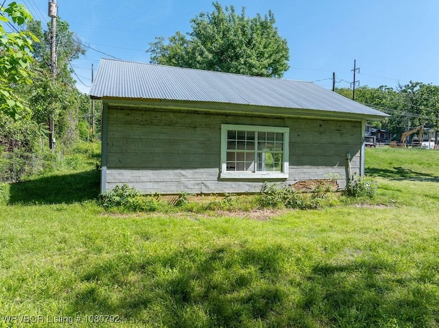 4308 25th St, Fort Smith, AR 72901 - view of property exterior featuring a lawn, metal roof, and concrete block siding