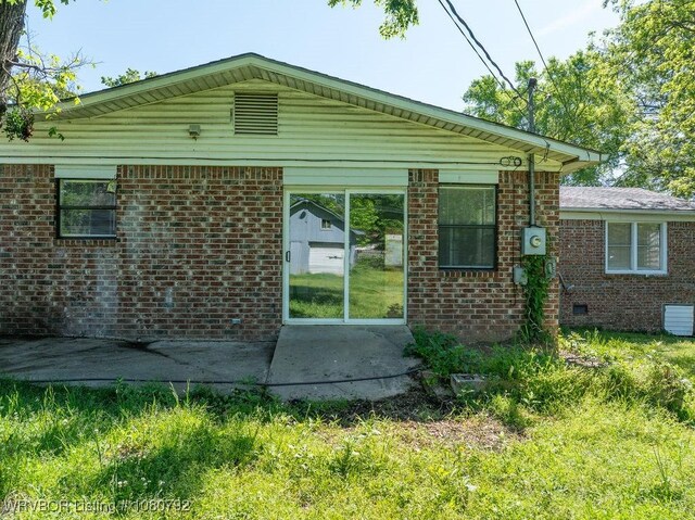 4308 25th St, Fort Smith, AR 72901 - view of property exterior featuring brick siding, crawl space, and a patio