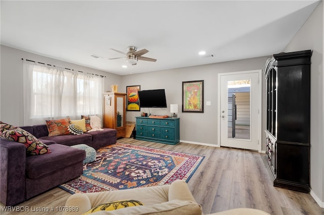 living area featuring light wood finished floors, recessed lighting, a ceiling fan, and baseboards