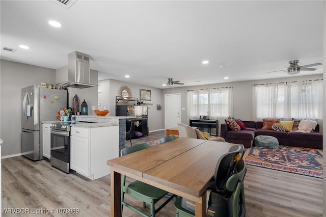 dining area featuring recessed lighting, baseboards, visible vents, and light wood finished floors