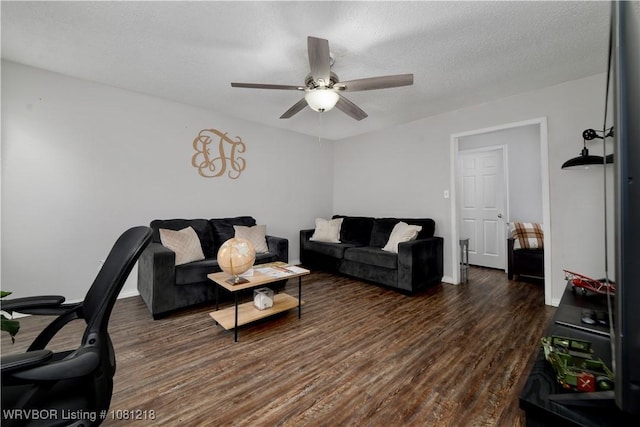128 Saskatchewan Rd, Roland, OK 74954 - living room featuring ceiling fan, wood finished floors, a textured ceiling, and baseboards