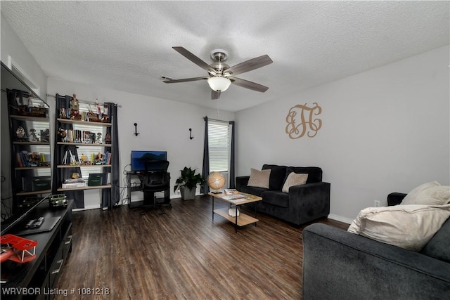 128 Saskatchewan Rd, Roland, OK 74954 - living area with dark wood-style flooring, ceiling fan, a textured ceiling, and baseboards