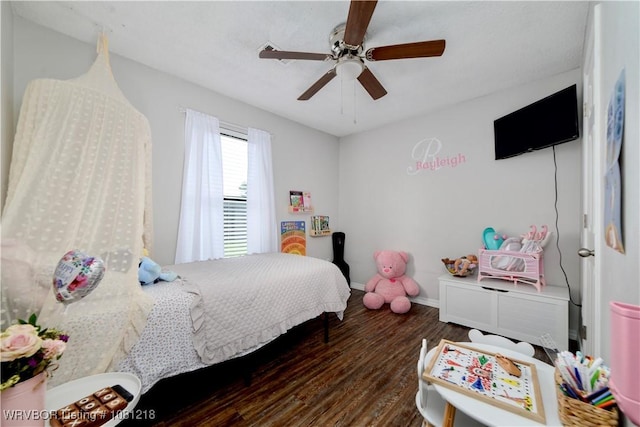 128 Saskatchewan Rd, Roland, OK 74954 - bedroom featuring wood finished floors, baseboards, and a ceiling fan