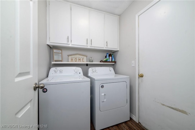 128 Saskatchewan Rd, Roland, OK 74954 - washroom with washing machine and clothes dryer, cabinet space, and dark wood-style flooring