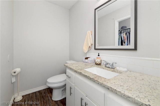 128 Saskatchewan Rd, Roland, OK 74954 - bathroom with vanity, toilet, wood finished floors, and baseboards