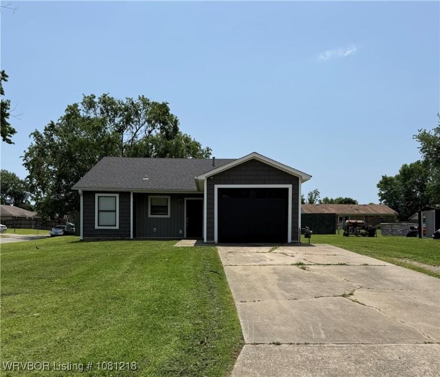 128 Saskatchewan Rd, Roland, OK 74954 - ranch-style house with an attached garage, a front lawn, and concrete driveway