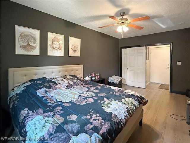 3809 Chaffee Dr, Fort Smith, AR 72904 - bedroom featuring wood finished floors, a textured ceiling, and ceiling fan