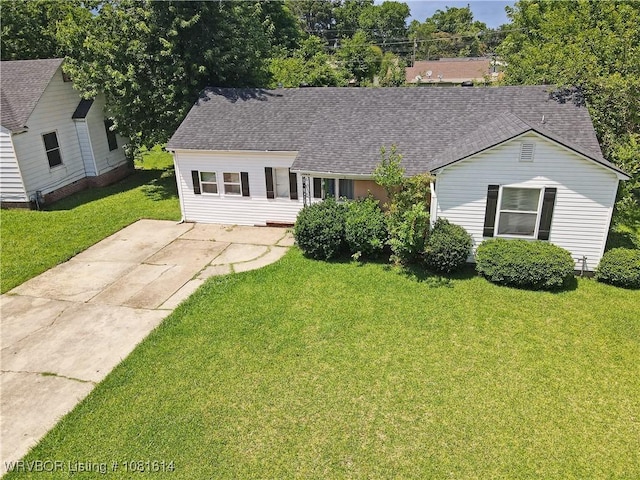 3809 Chaffee Dr, Fort Smith, AR 72904 - view of front facade featuring a front yard, a shingled roof, and driveway