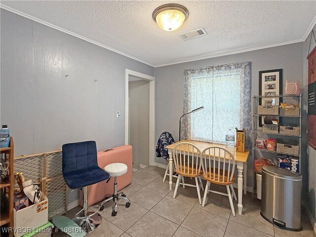 3809 Chaffee Dr, Fort Smith, AR 72904 - dining space featuring crown molding, light tile patterned flooring, and a textured ceiling
