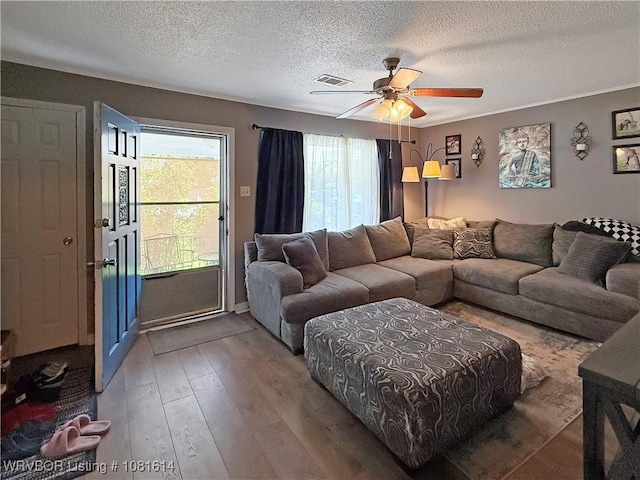 3809 Chaffee Dr, Fort Smith, AR 72904 - living room featuring a textured ceiling, wood finished floors, and ceiling fan