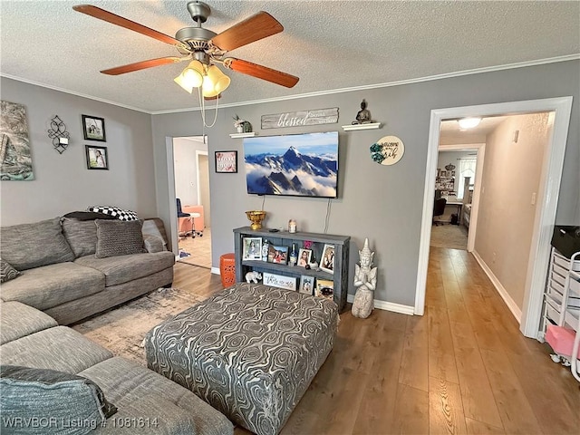 3809 Chaffee Dr, Fort Smith, AR 72904 - living room featuring wood-type flooring, a ceiling fan, ornamental molding, and a textured ceiling