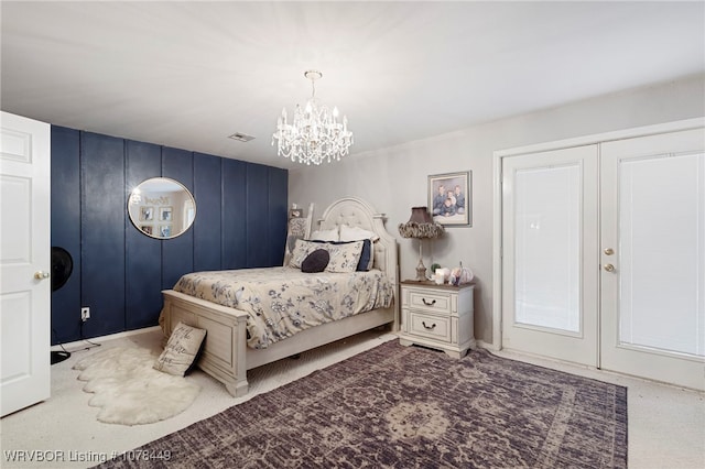 bedroom with a notable chandelier