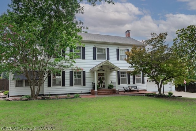 colonial inspired home with a front yard