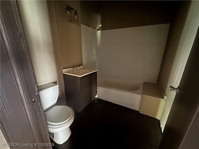 bathroom with toilet, vanity, and tub / shower combination