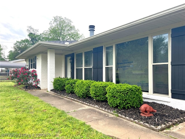view of property exterior featuring a yard